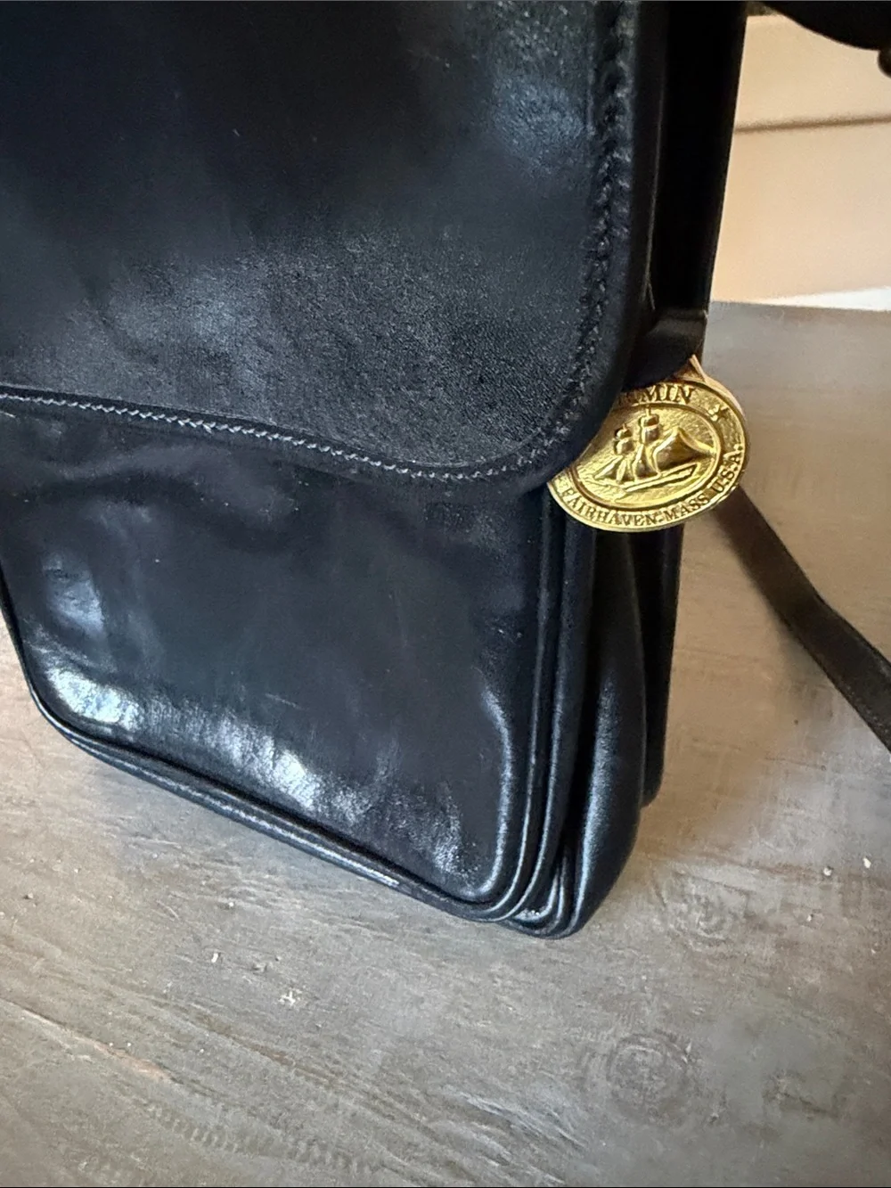 Brahmin Black Leather Messenger Bag with Gold Medallion